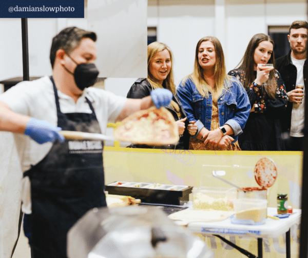 pizza chef cooks pizzas for corporate work event